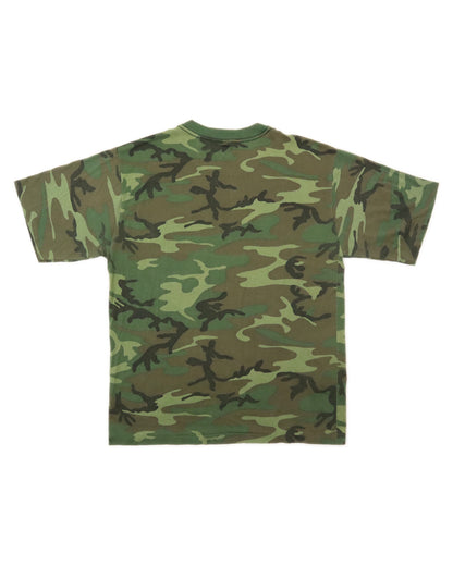 Camouflage-patterned t-shirt on a white background