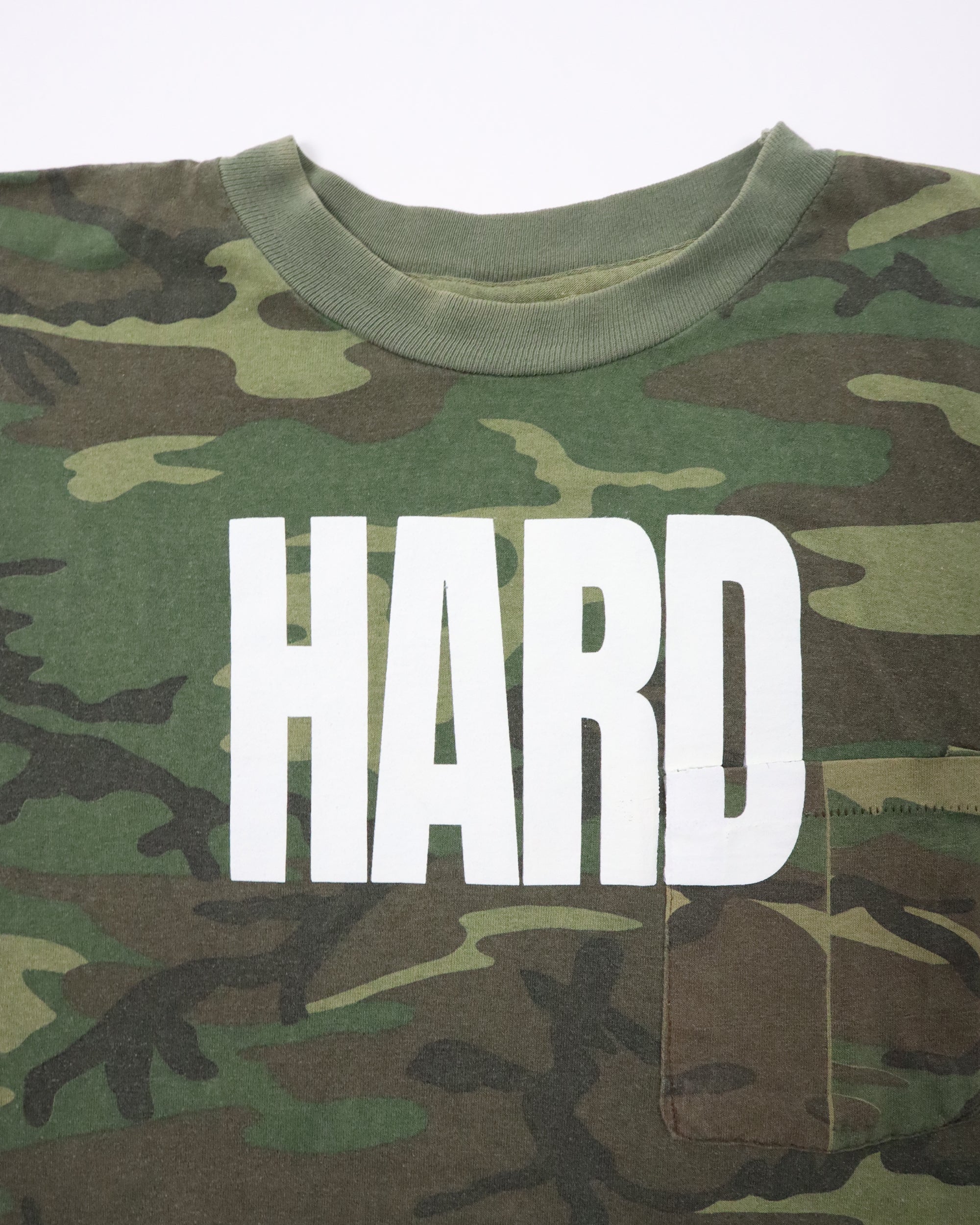 Camouflage shirt with 'HARD' printed in white on a plain background