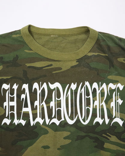 Camouflage t-shirt with 'HARDCORE' text in white on a white background