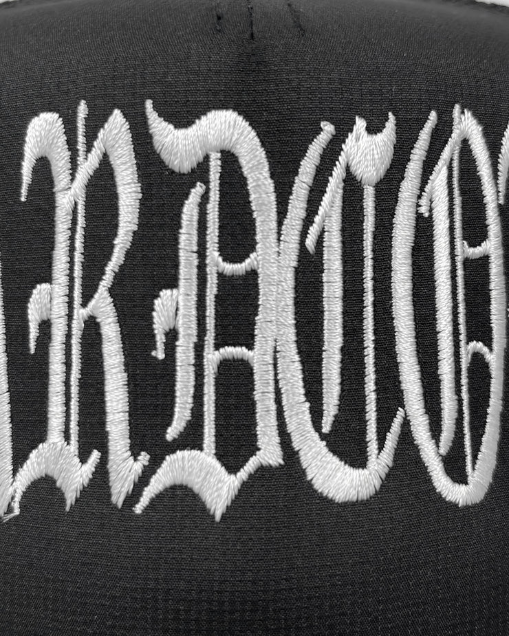 Black cap with white embroidered text on a black background