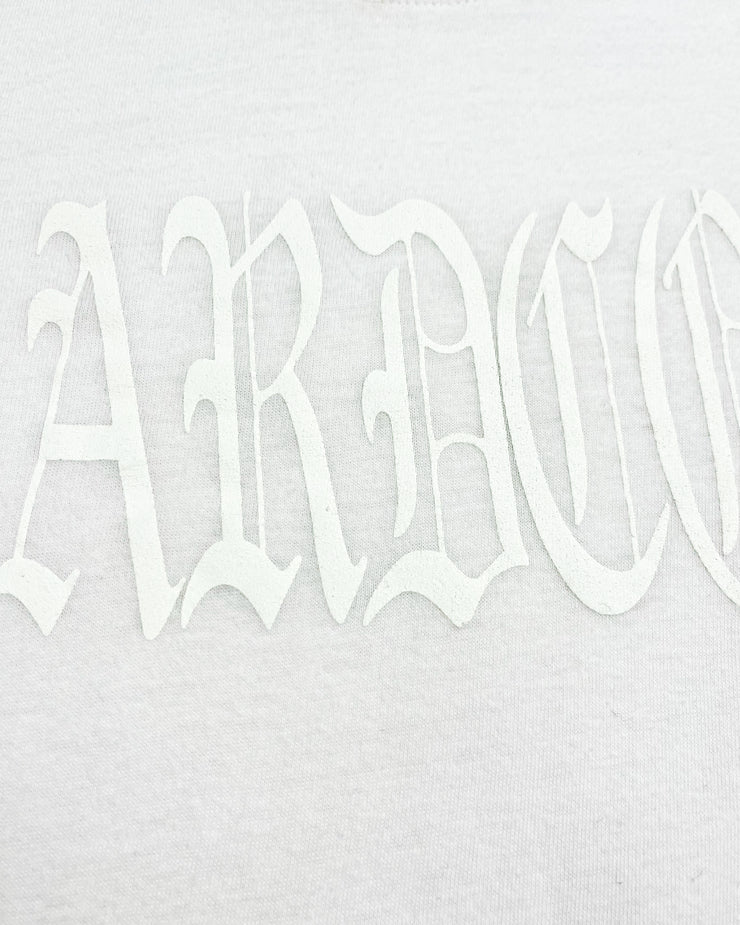 Close up of white text on a white t-shirt