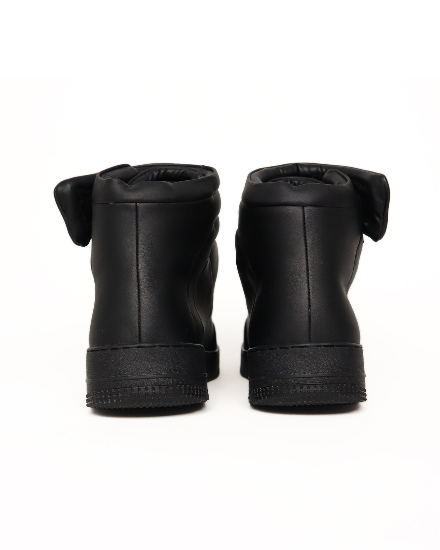 Black high-top sneaker on a white background