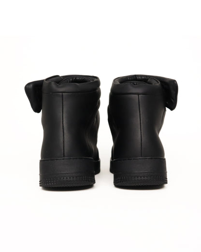 Black high-top sneaker on a white background