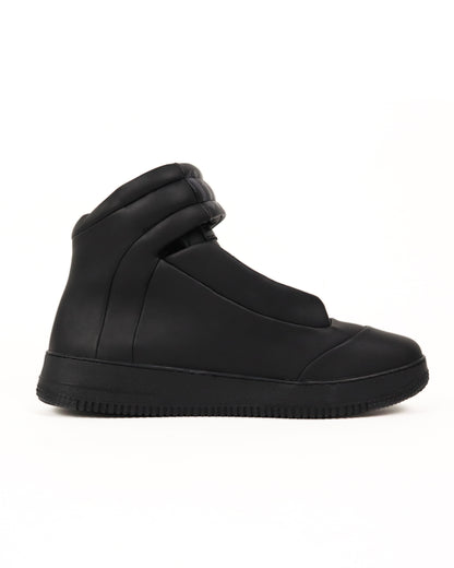 Black high-top sneaker on a white background
