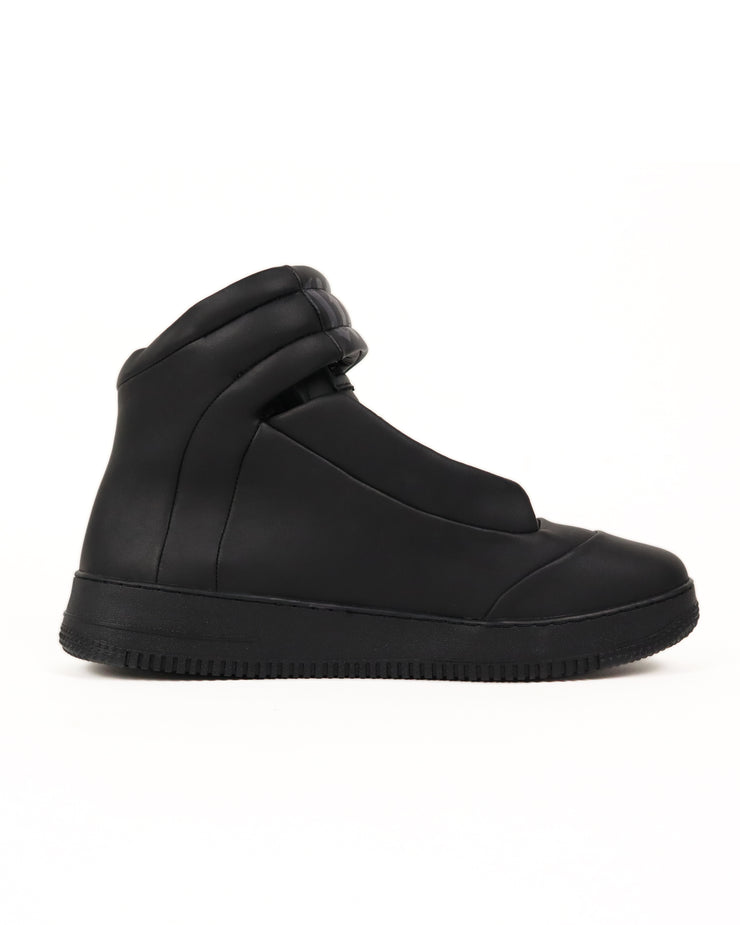 Black high-top sneaker on a white background