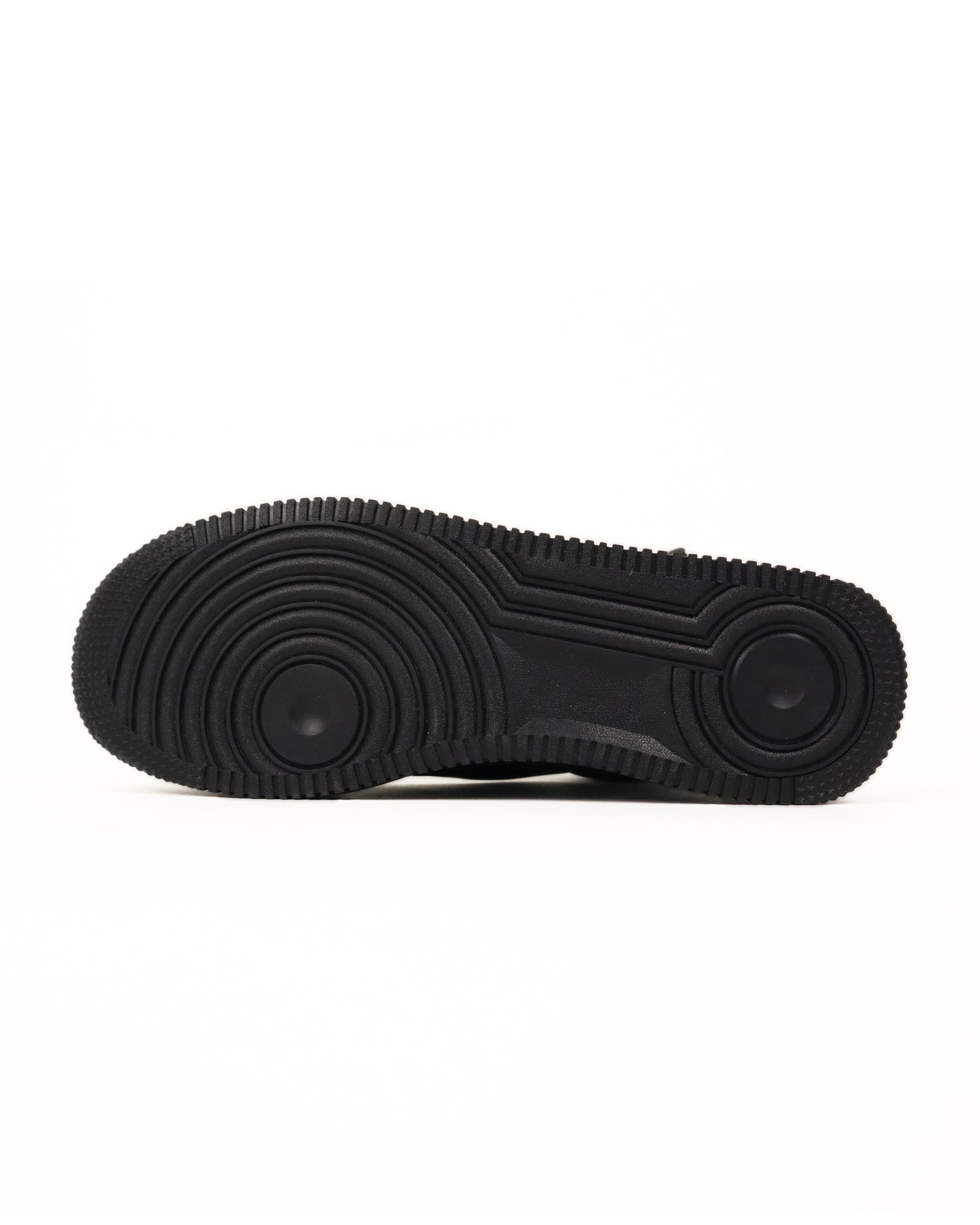 Bottom sole of black high-top sneaker with colorful graphics on a white background