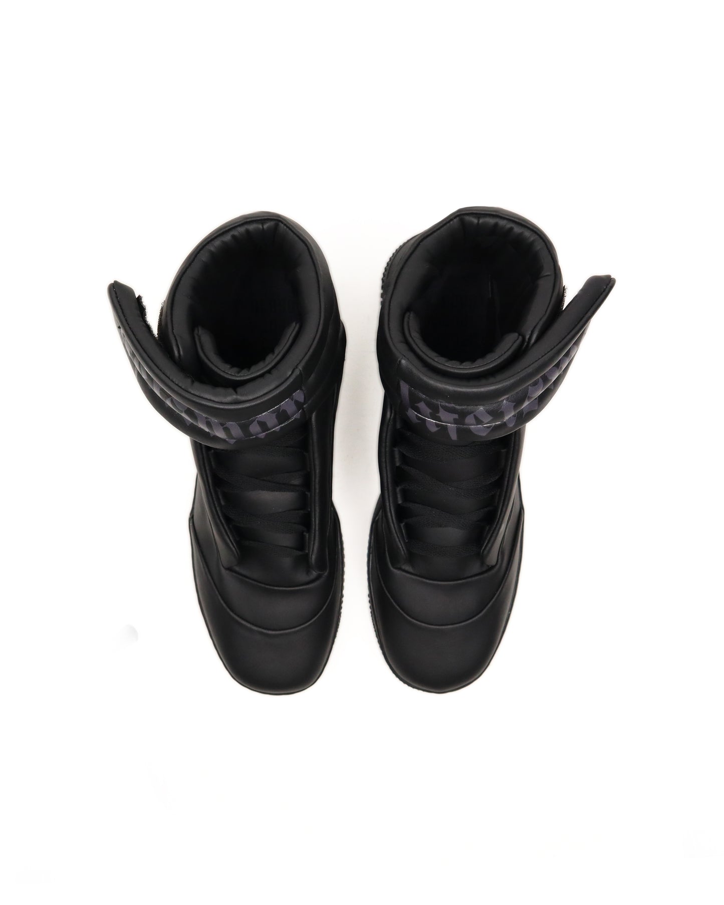 Pair of black high-top sneakers with visible brand logo on a white background