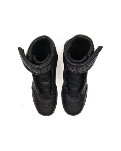Pair of black high-top sneakers with visible brand logo on a white background