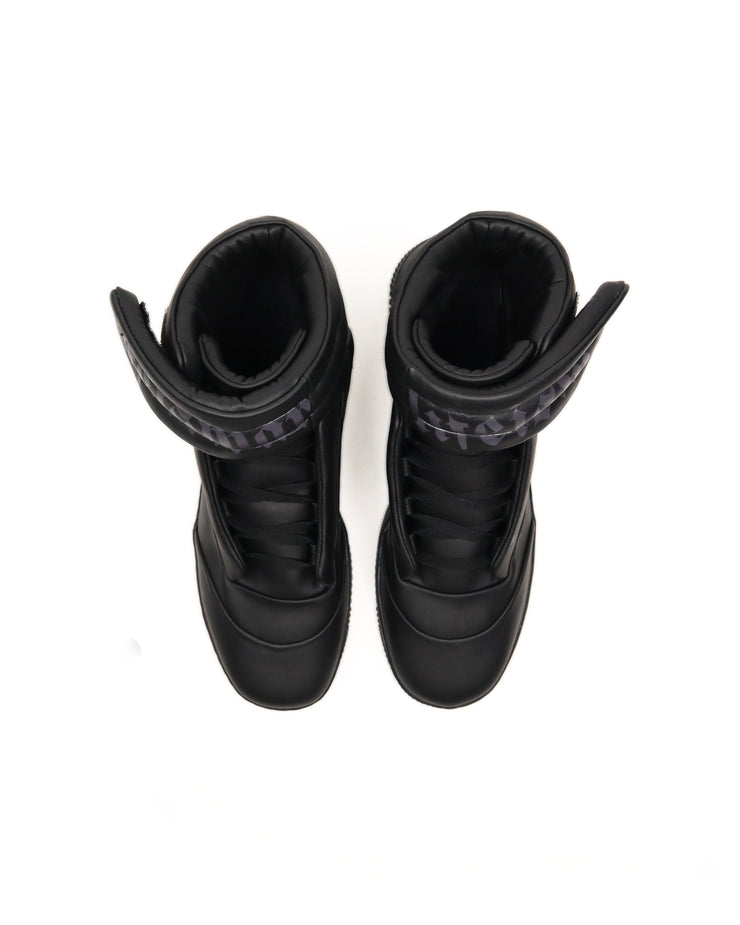 Pair of black high-top sneakers with visible brand logo on a white background
