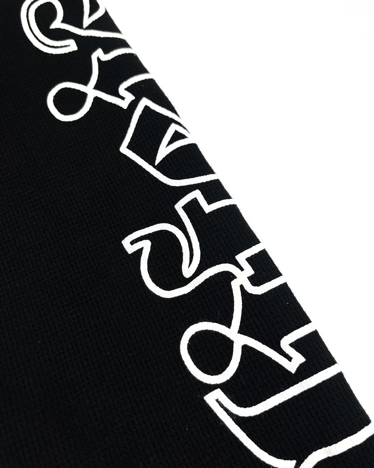 Close up of black thermal long sleeve with text "LIFEISWAR"